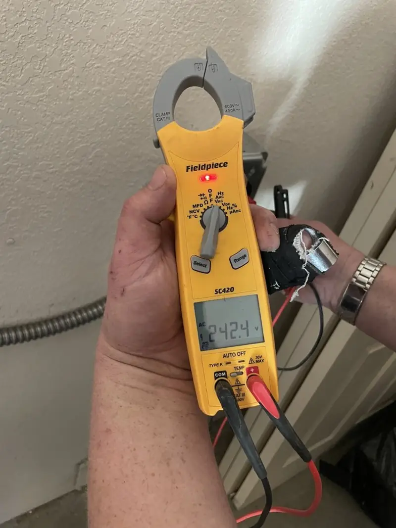 Voltage testing with clamp meter during Ceiling Fan Installation in Sansom Park